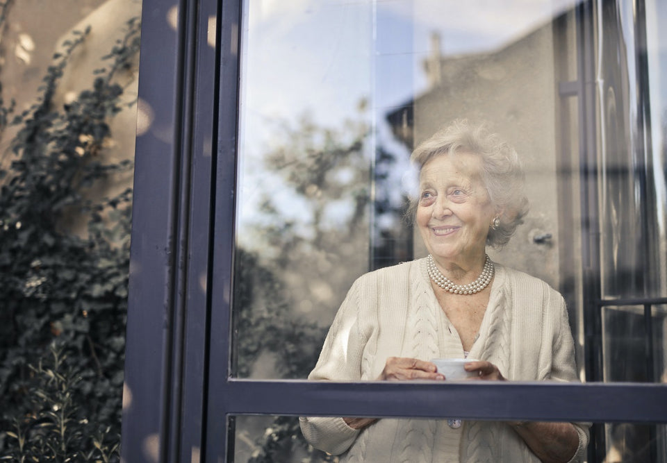 Personal Alarms Australia Elderly woman looking through window